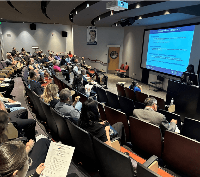 Auditorium with seats and a projector presenting information