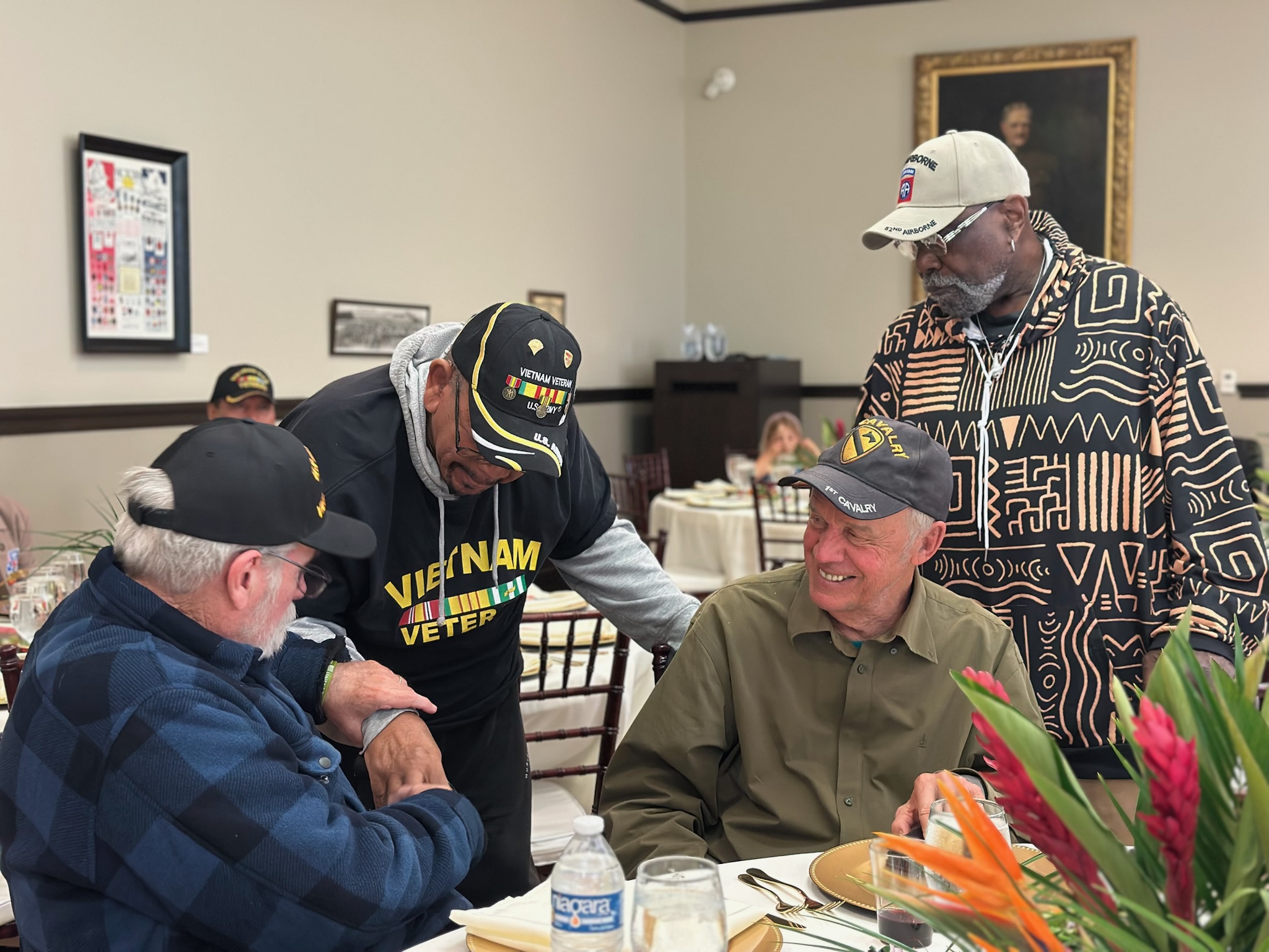 Veterans talking at a table
