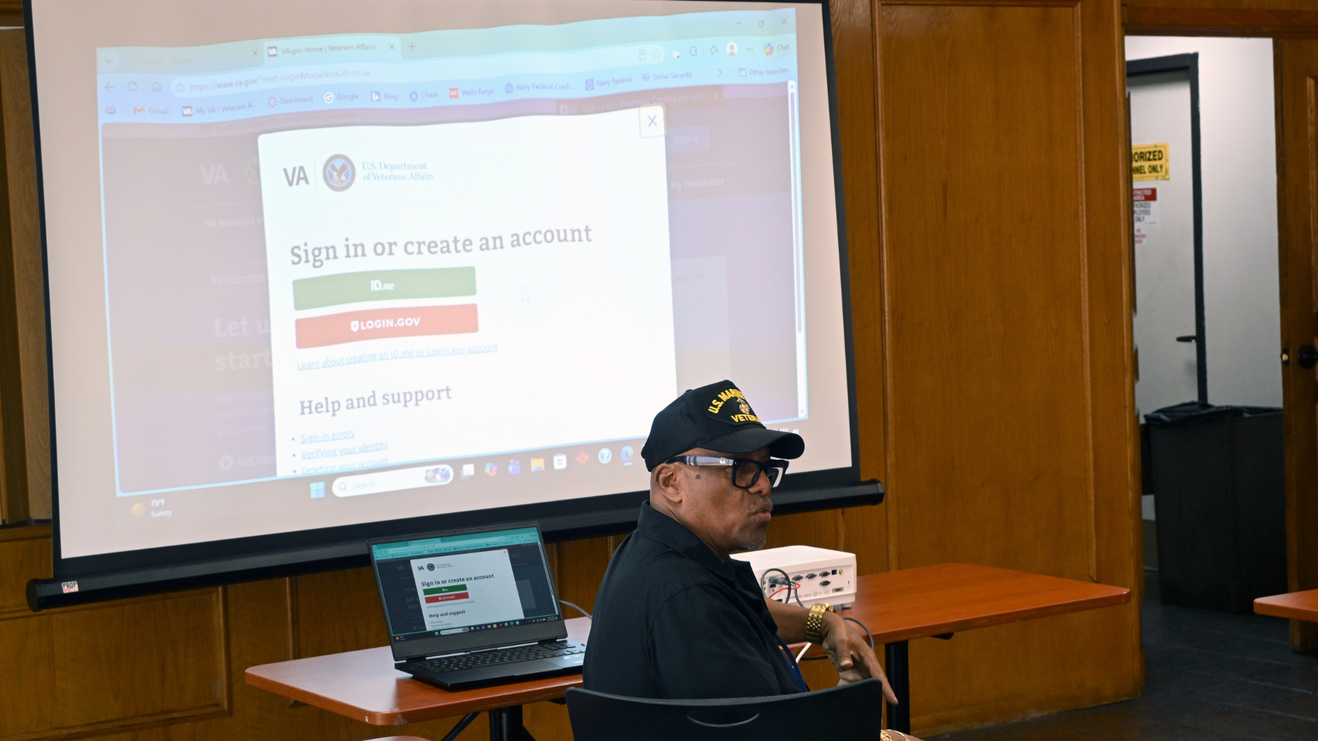 An instructor sits in front of a projected VA.gov sign-in page during Operation Access Granted.