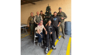 County outreach partners and a VPAN peer stand with U.S. Army veteran Wesley Clemans and his wife during a coordinated effort to support their transition into interim housing, reflecting veteran-centered care and collaboration.